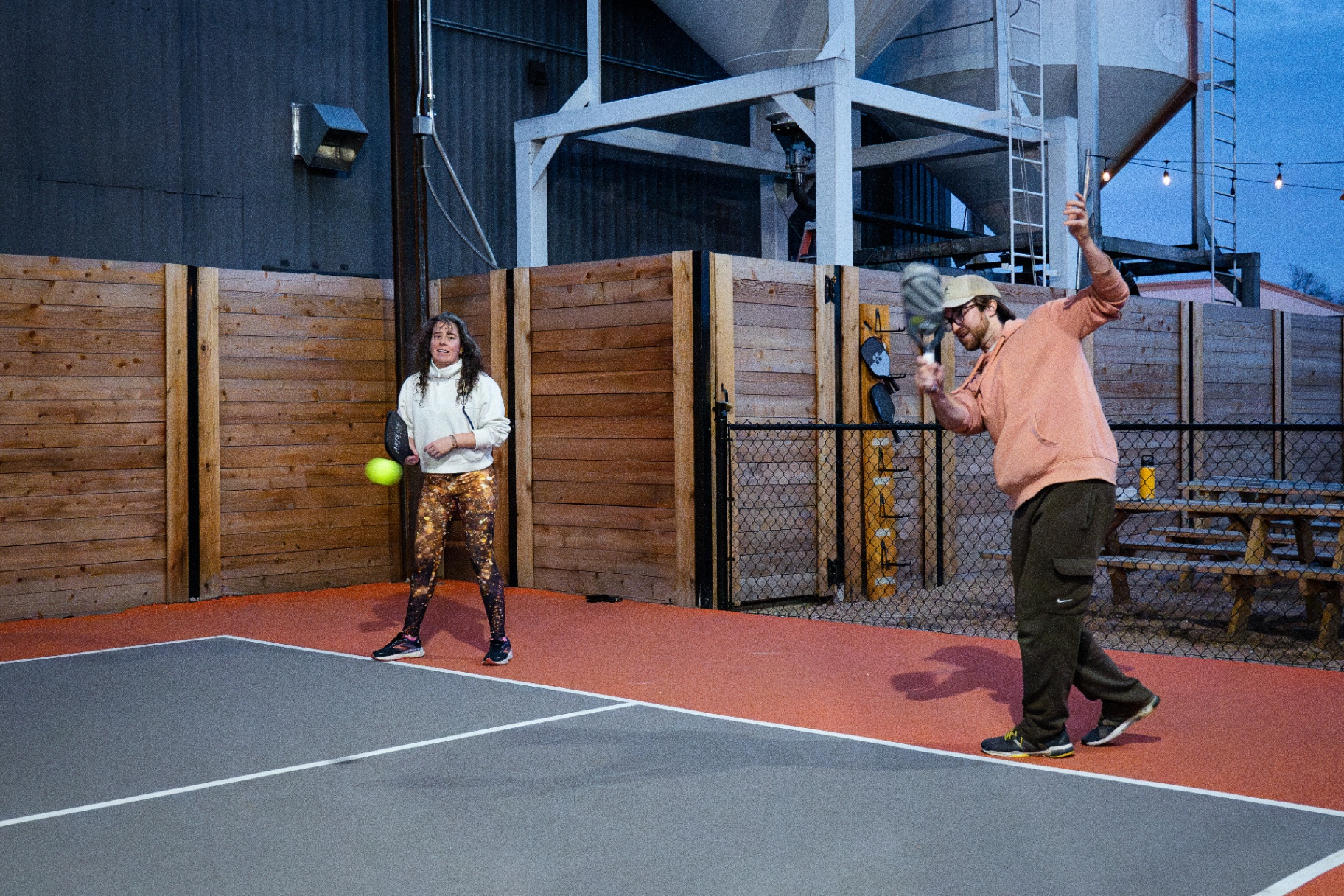 Pickleball rally on the covered outdoor courts